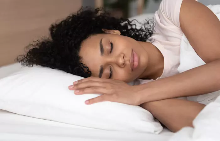 Woman sleeping peacefully to manage weight gain