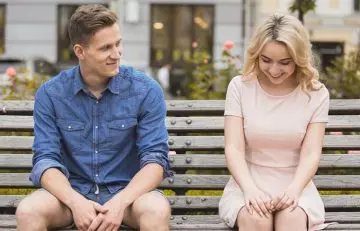 Leo man looking lovingly at a smiling blonde woman