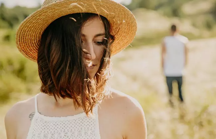 Woman and man walking away from each other