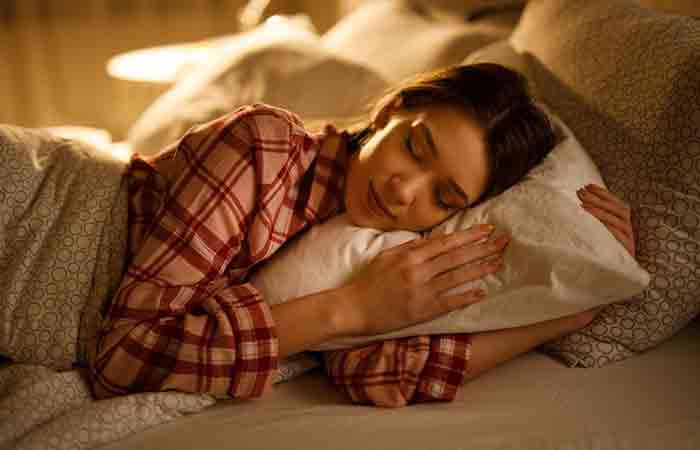 Woman sleeping well at night after consuming rooibos tea