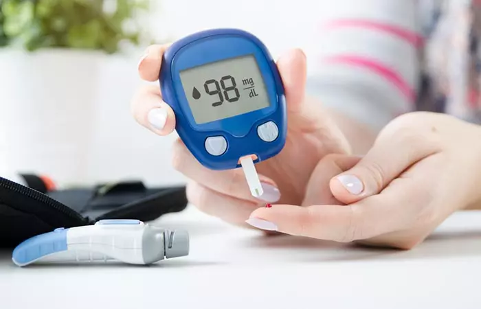 Woman checking blood sugar levels