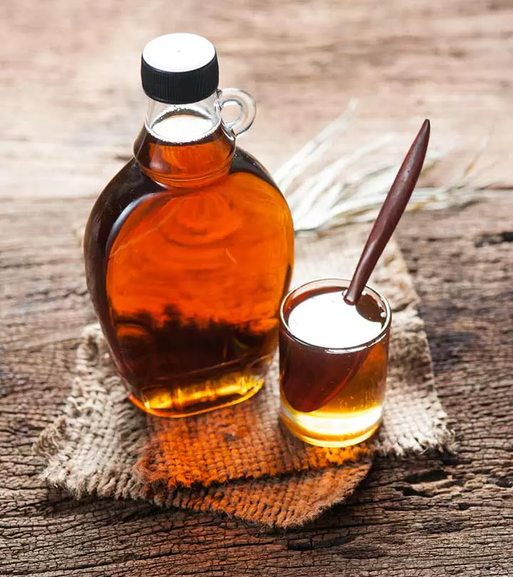 Maple syrup in a glass bottle and in a small glass