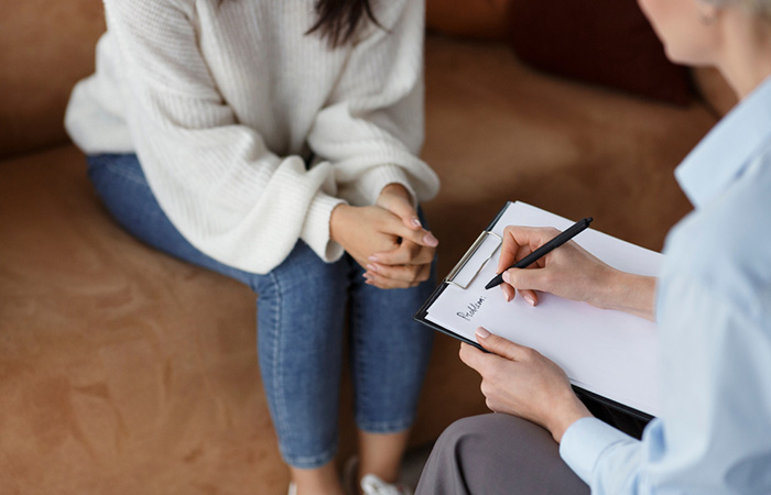 Woman attending psychotherapy to manage weight gain