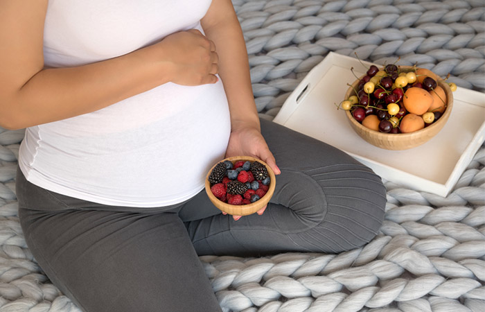 Pregnant woman being careful for eating juniper berries