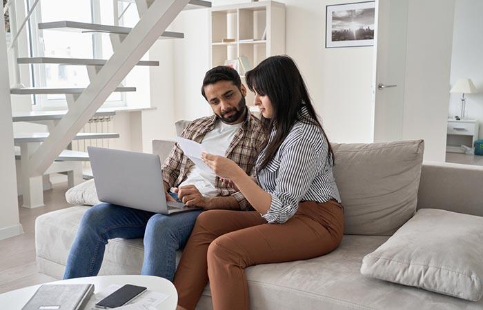 Couple sitting together at home