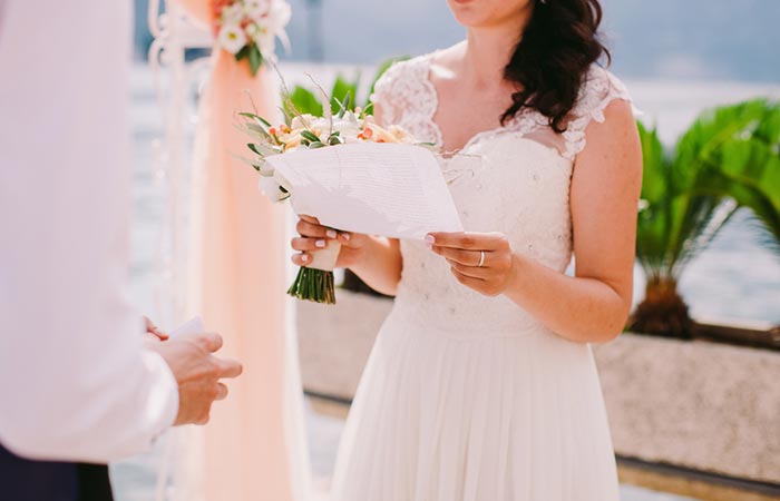 Bride reading traditional wedding vows