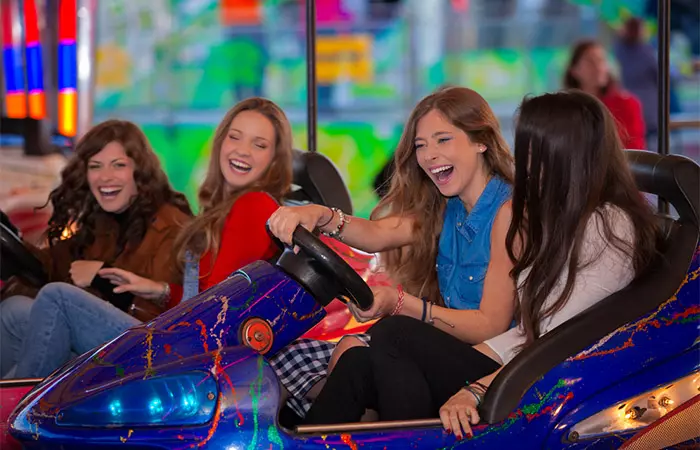 A group of girlfriends enjoying at amusement park.