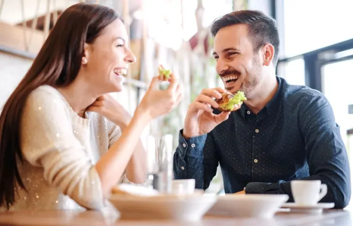 A cute couple enjoying meals together