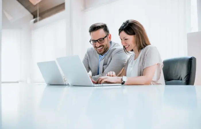 A cute couple working in office