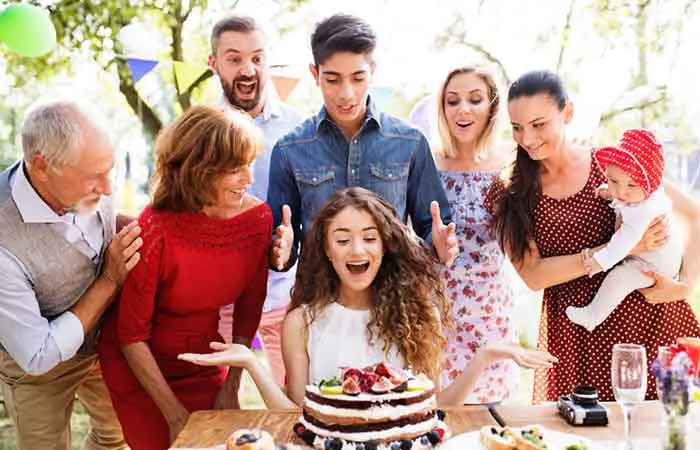 A teen enjoying an outdoor picnic with family for her 16th birthday