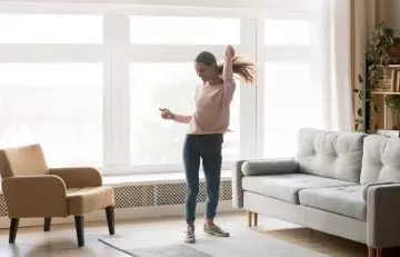 Woman dancing as an exercise to lower blood pressure