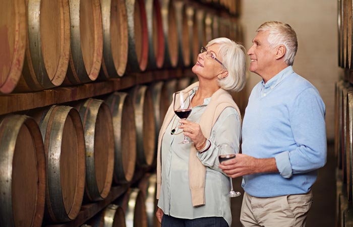 A couple at a wine tasting for their 50th wedding anniversary