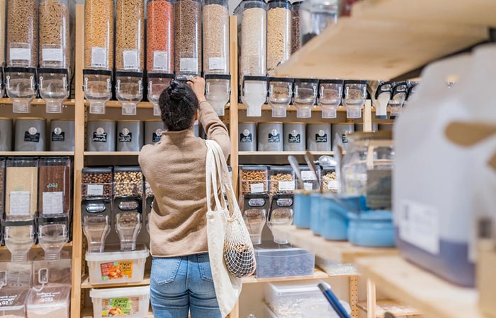 Woman getting amino-acid rich grains from a supermarket