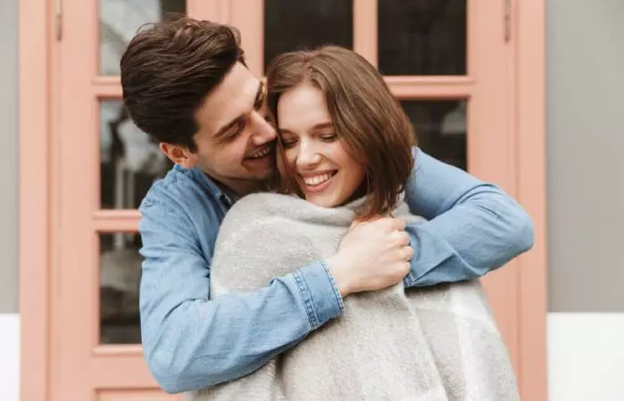 Happy husband hugging his wife