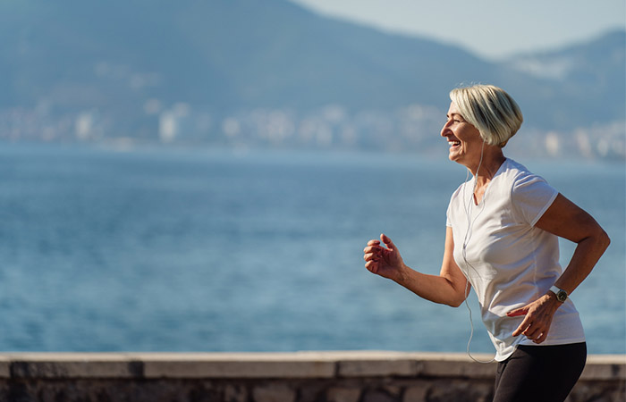 Elderly woman jogging with good heart health and reduced diabetes