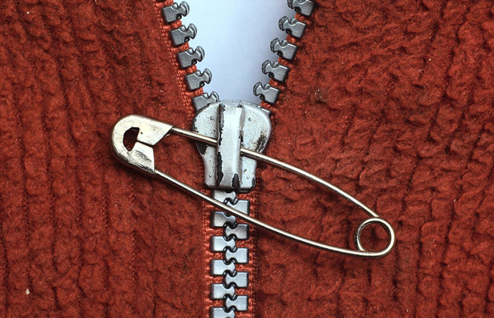 Paper clip puller or a safety pin helps to fix the broken zipper