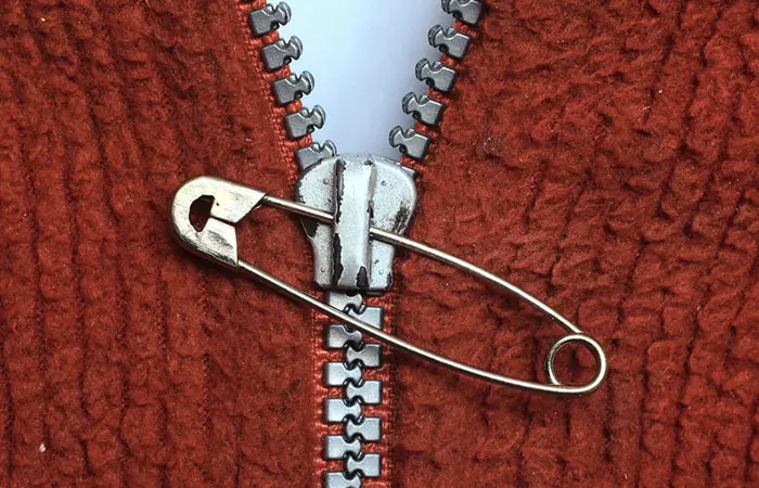 Paper clip puller or a safety pin helps to fix the broken zipper