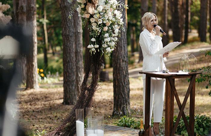 A wedding officiant leads the marriage ceremony