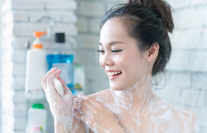 Woman using antibacterial soap to prevent skin infections
