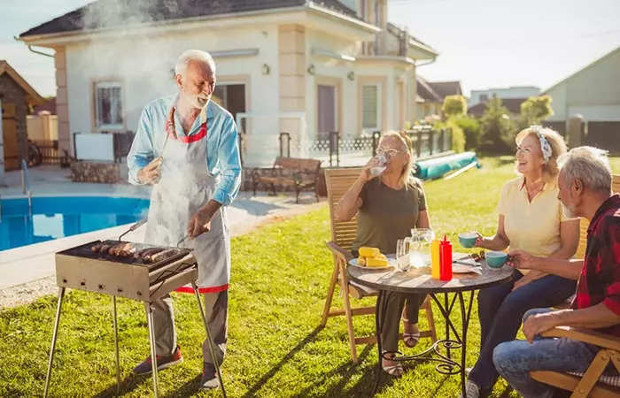 Man having a 60th barbeque birthday party 