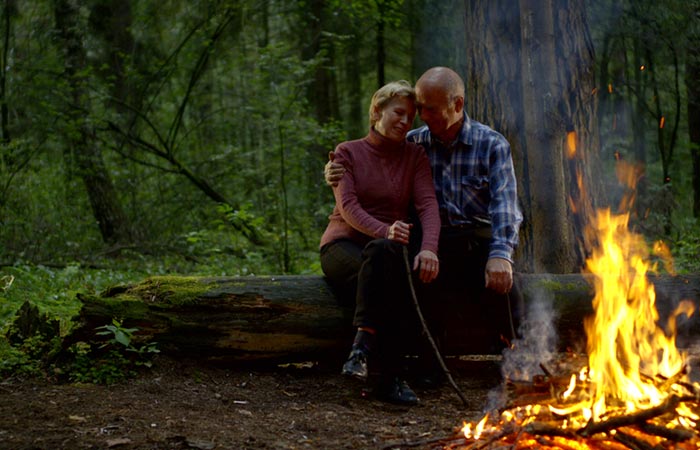 A couple at a camping getaway to celebrate their 50th wedding anniversary