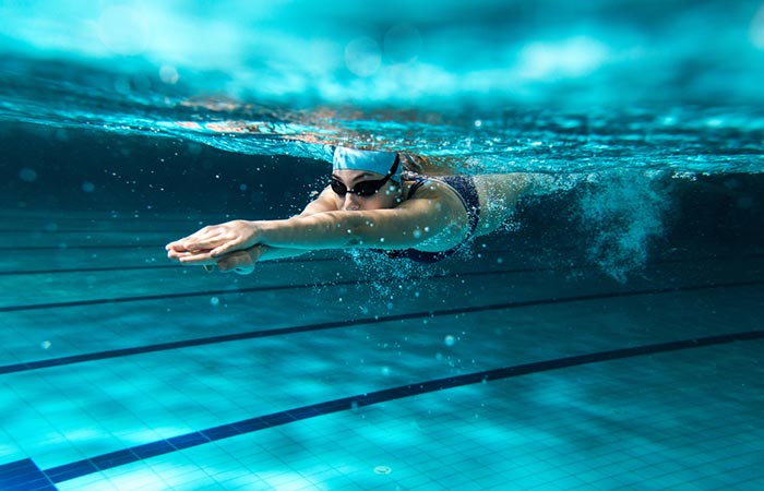 Woman swimming to lower blood pressure