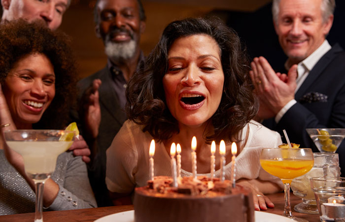 Throw a surprise party on your friend's 50th birthday