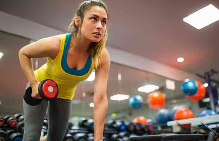 Woman doing weight training for better heart health