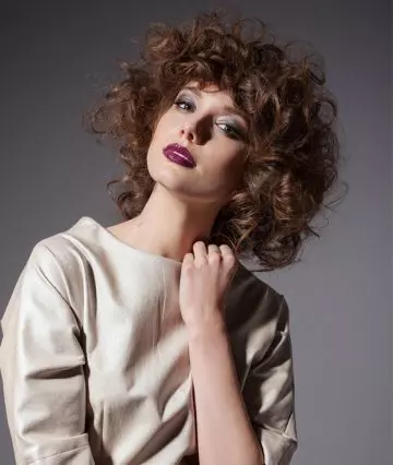 A woman with a curly inverted bob hairstyle