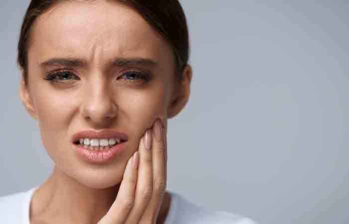 Woman with toothache due to sucralose