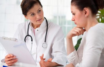 Woman keeping her doctor informed about her symptoms of adderall tongue