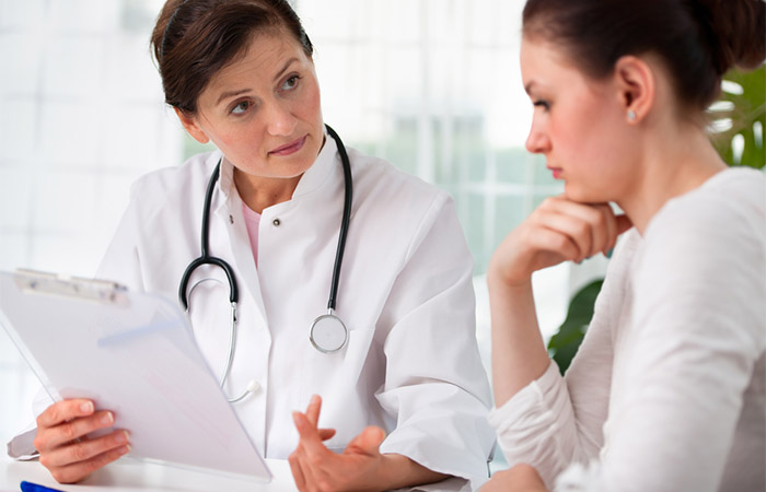 Woman keeping her doctor informed about her symptoms of adderall tongue
