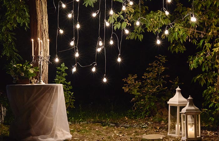 Use lights and lanterns to light up your backyard wedding