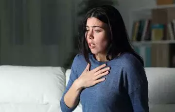 Woman experiencing suffocation which can lead to cyanosis