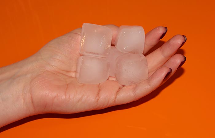 Ice cubes placed on hands.