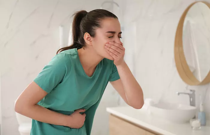 Woman feeling nausea due to side effect of moringa tea