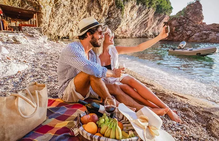 A relaxed couple on the beach for an outdoor date