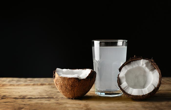 Glass of coconut water with coconut