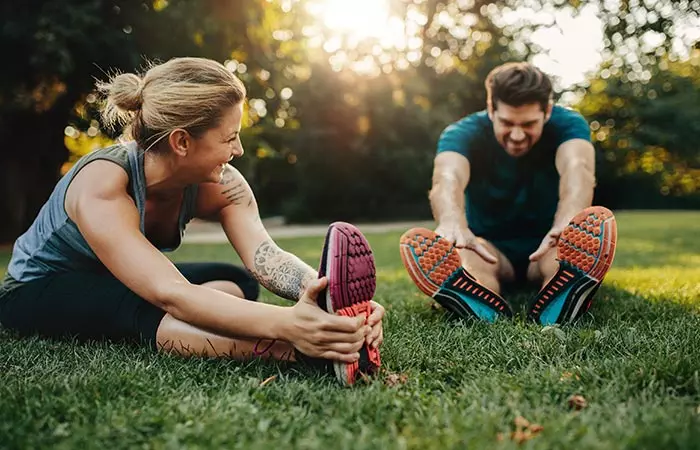 Couple warming-up before exercise