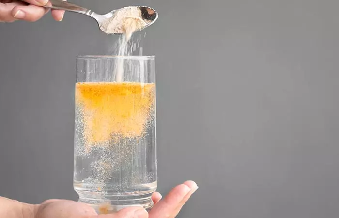 Close-up of person making electrolyte solution to keep skin turgor in check