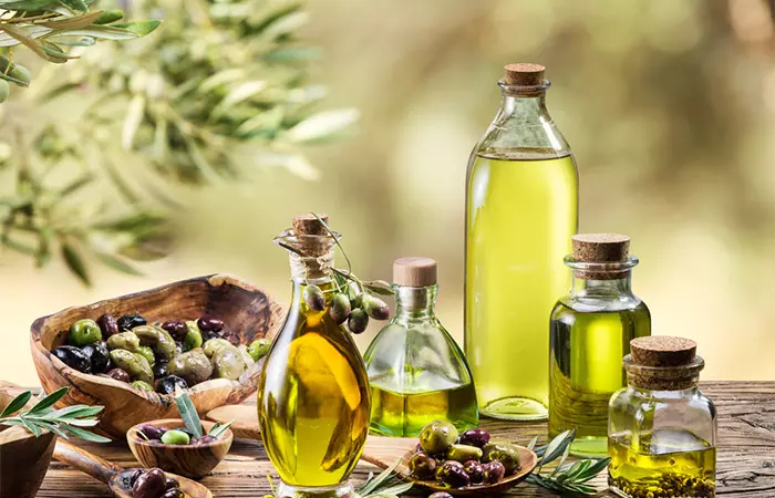 Bottles of olive oil with oilve berry