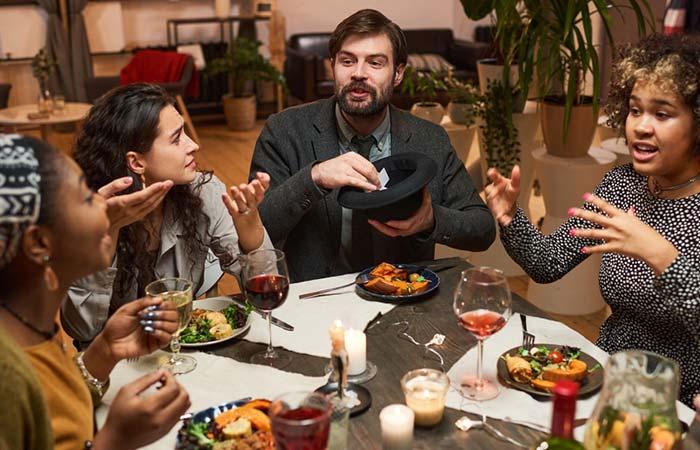 A group of friends playing games during a dinner party