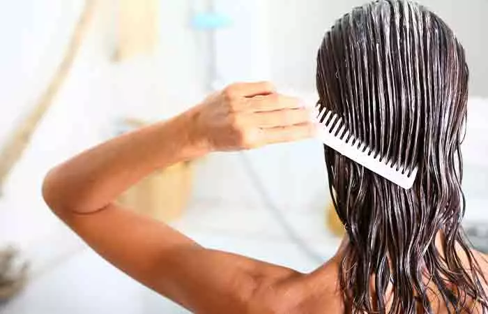 A woman using kokum butter as hair mask