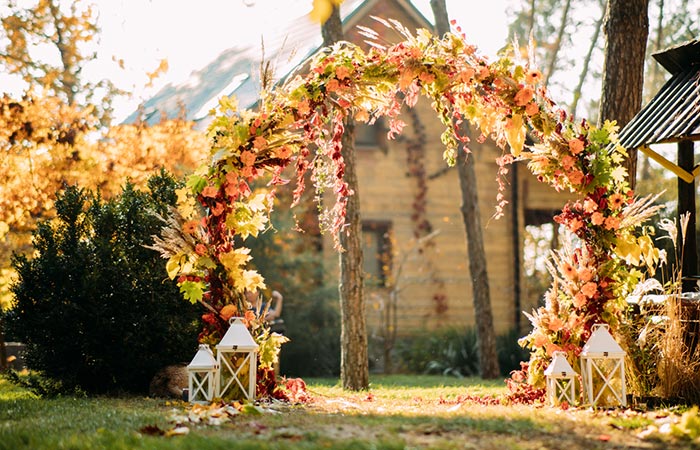 A fall wedding arch in autumn colors