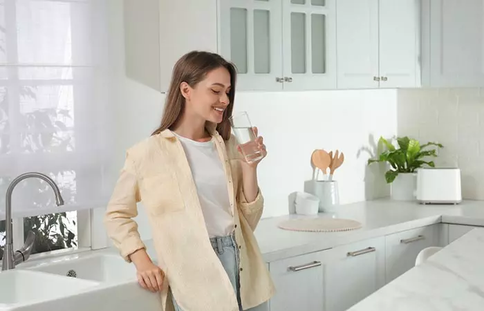 A healthy woman drinking okra water