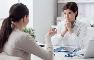 A woman consulting with a doctor