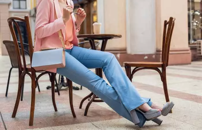 Woman wearing flared jeans