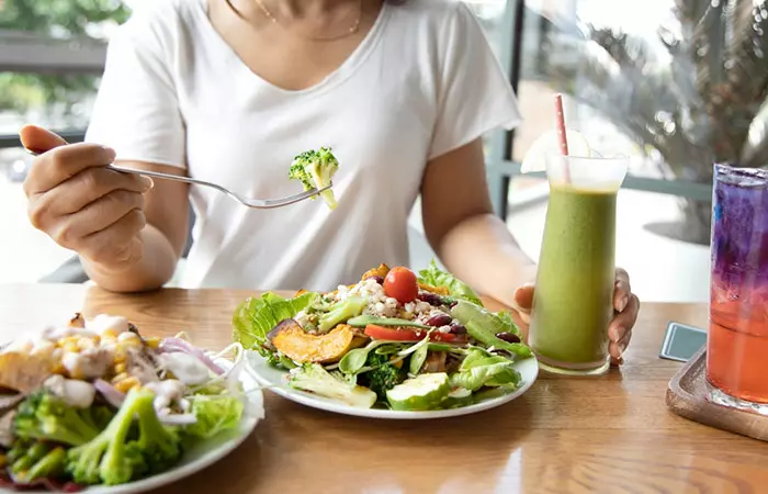 Woman eating healthy food to lighten dark lips