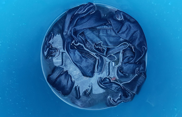 Shrink your jeans by placing them in boiling water