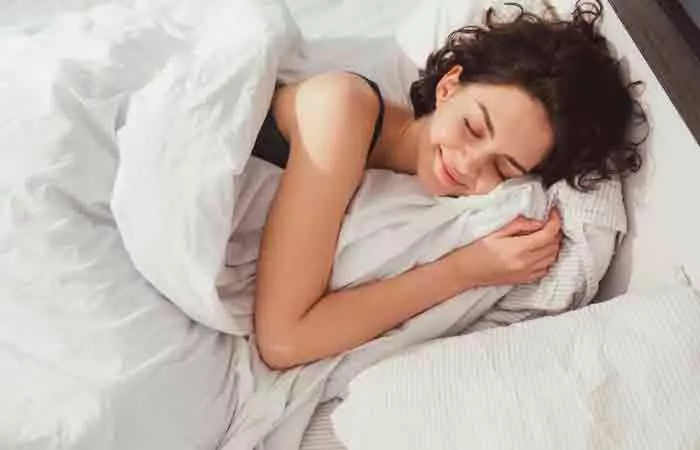 Woman sleeping blissfully at night